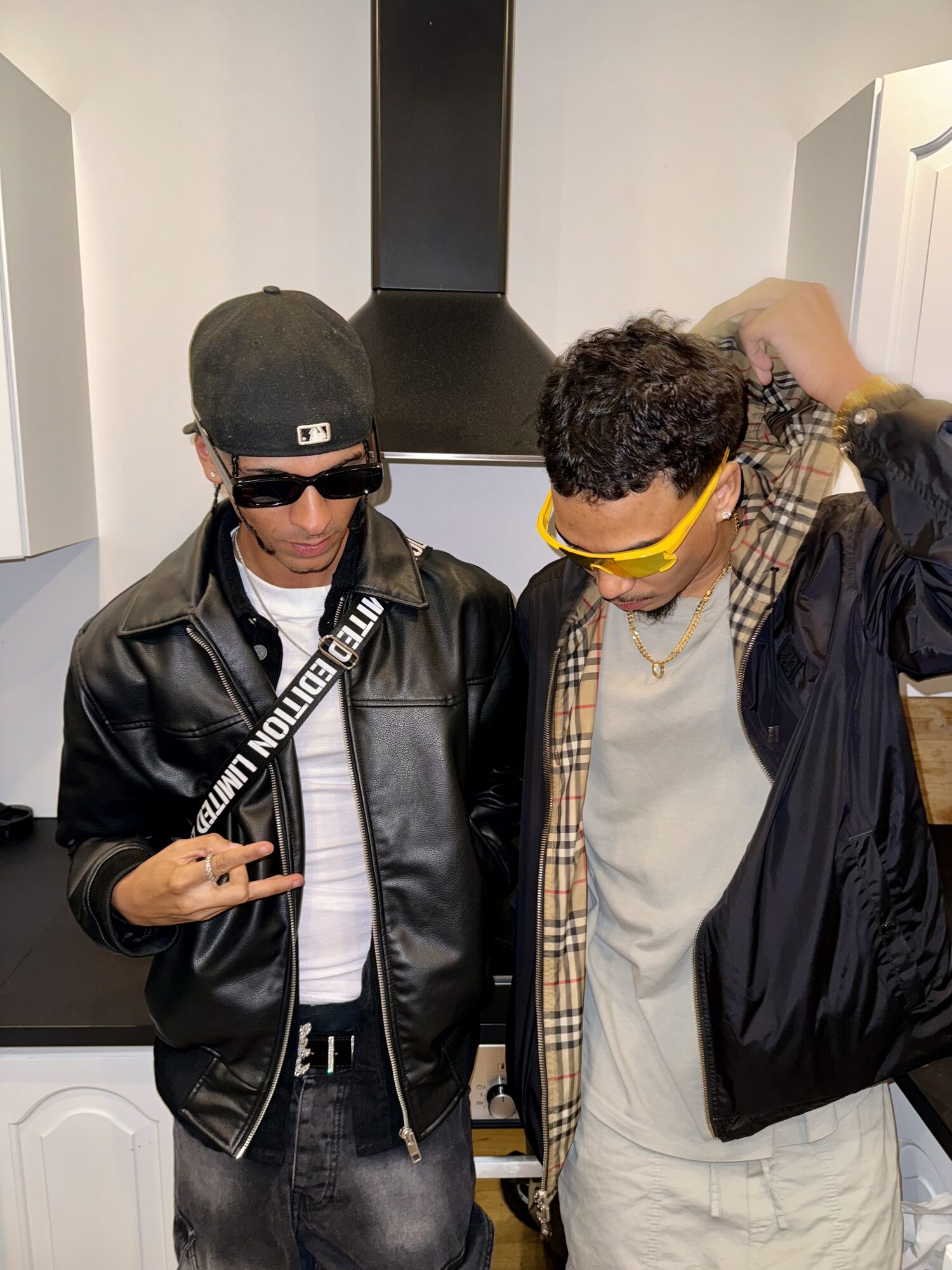 Joshua Arthur (JJDREAMSS) · Oslo · 2024 — Kitchen, sunglasses on, both of them posing like it's a cover shoot